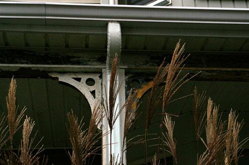 This image shows the ornamental brackets under the veranda roofline; City of Saint John