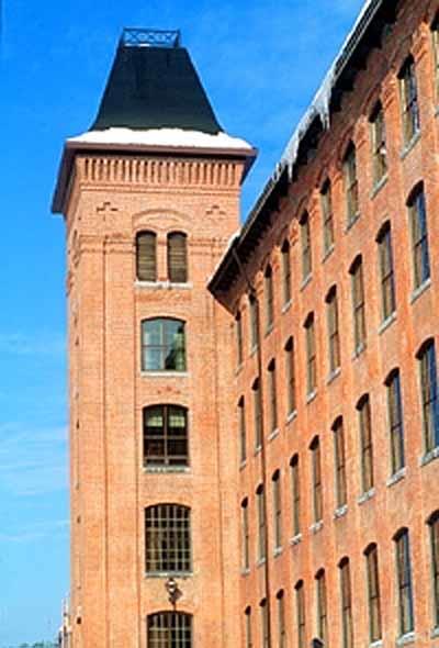 Detail view of the Marysville Cotton Mill emphasizing the decorative brickwork particularly along the main façade, 1995.; Parks Canada Agency / Agence Parcs Canada, J. Butterill, 1995.
