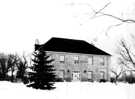 Façade of Twin Oaks, showing its rectangular plan, hipped roof, and symmetrical design of a five-bay façade with a central entrance, 1960.; Manitoba Archives, 1960.