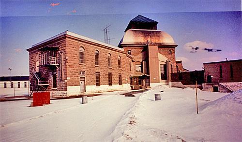 General view of the joining point of the south wing and the dome of Saint-Vincent-de-Paul Penitentiary showing its abundant use of stone materials and their skillful craftsmanship.; Parks Canada Agency / Agence Parcs Canada, n.d.