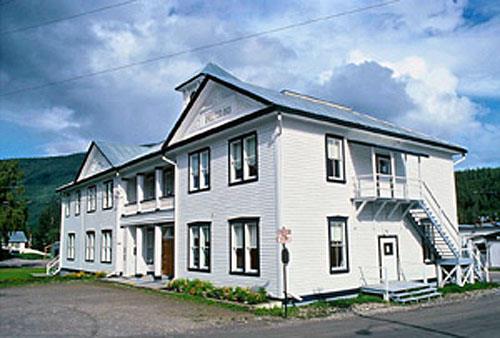 General view of the Former Territorial Court House, showing its wood-frame construction adapted to cope with permafrost and fine finishing details, all evocative of high standards of craftsmanship, 1995.; Parks Canada Agency / Agence Parcs Canada, W. Lynch, 1995.