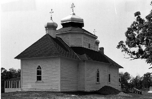 Rear view of St. Michael's Ukrainian Greek Orthodox Church, showing its massing, reflecting the three interior frames, indicative of its Ukrainian influence.; Parks Canada Agency / Agence Parcs Canada.