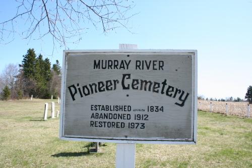 Showing cemetery sign; Donna Collings, 2008