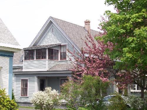 
View of the south side of the house, showing the gable, the porch and the side entrance
; City of Fredericton