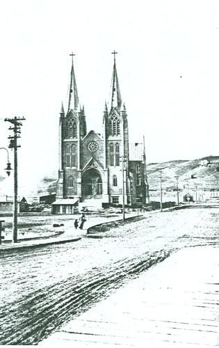 General view of St. Patrick, showing its location, slightly set back from the street, 1914.; Parks Canada Agency / Agence Parcs Canada, 1914.