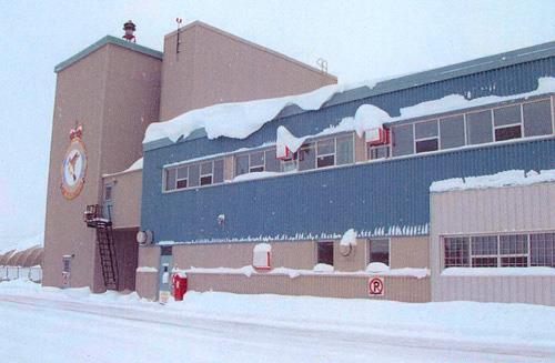 View of the exterior of Hangar 6, showing the use of economical but durable materials in neutral colours, put together using proven construction methods, 2006.; Department of National Defence / Ministère de la Défense nationale, 2006.