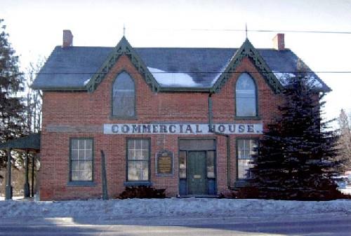 Exterior view of the Former Commercial Hotel, showing the physical references to its former functions, including the painted sign “Commercial Hotel” marking its front façade, 2005.; Public Works and Government Services Canada / Travaux publics et services gouvernementaux Canada, 2005.