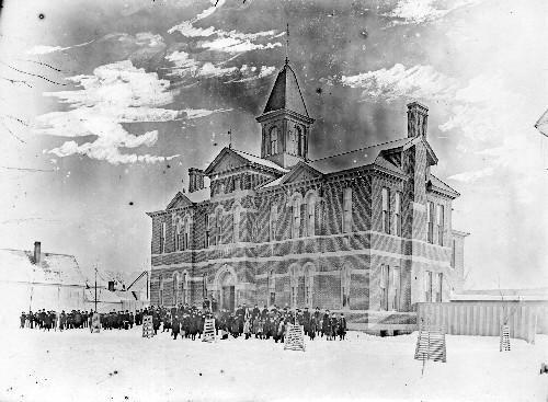 Historic photograph of the school from the George T. Taylor Collection showing the original school building; Provincial Archives of NB, image P5-327