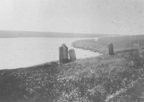 View of stones standing near bank, c 1970; PEI PARO P0002994 - Cemetery Files/21-9/P-1