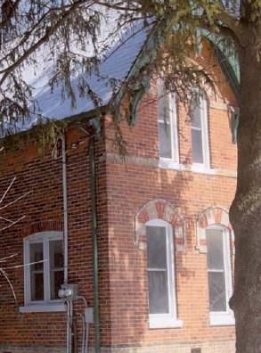 Corner view of Former Miller Residence, showing the dichromatic brickwork, 2005.; Department of Public Works and Government Services / Ministère des Travaux publics et services gouvernementaux, 2005.
