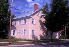 Image shows the southern exposure and the frontage of this dwelling which occupies a large corner lot at the juncture of Smythe and Charlotte Streets; City of Fredericton