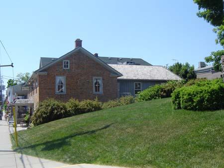 Featured are the low gabled roof and return eaves of the two-bay north elevation.; Kayla Jonas, 2007.