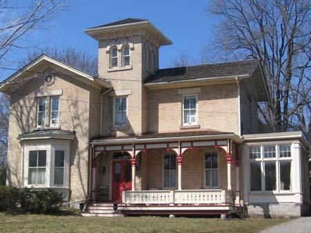 This image offers a view of the picturesque veranda, as well as the 19th-Century cast-iron steps.; Lindsay Benjamin, 2007.