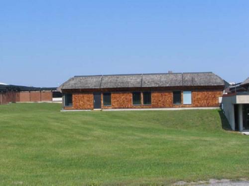 General view of Block 1200, showing its low height and weighty massing, 2005.; Parks Canada Agency / Agence Parcs Canada, Kate MacFarlane, 2005.