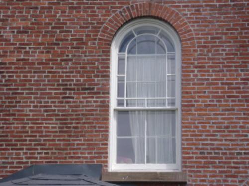 This photograph shows the Roman arch window on the south façade of the building, 2007; Town of St. Andrews