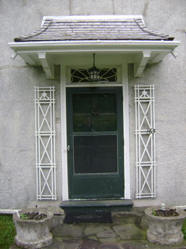 This photograph shows the entrance with shingled roof, 2007; Town of St. Andrews