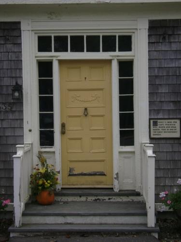 This photograph shows the wood door, transom window and sidelights, 2007; Town of St. Andrews