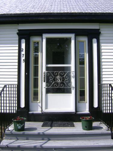 This photograph shows the entrance of the residence and illustrates the sidelights and pilasters, 2008; Town of St. Andrews