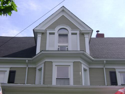 This photograph illustrates the dormer and bay window at the upper sections of the central bay above the entrance, 2008; Town of St. Andrews