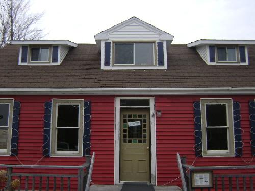 This photograph shows the central bay of the Doon Residence and illustrates the large dormer and entranceway, 2008; Town of St. Andrews