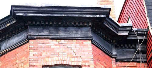 This image shows the building's cornice; City of Saint John, 2007