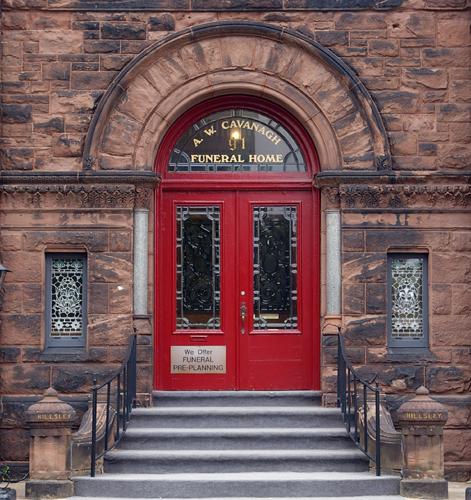 This image shows the heavy ornamentation of the Romanesque Revival entrance; City of Saint John