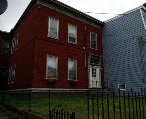 Shows deeper setback from Duke Street than neighbours; City of Saint John