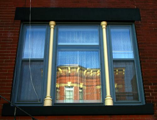 This image shows the tripartite window on ground floor; City of Saint John