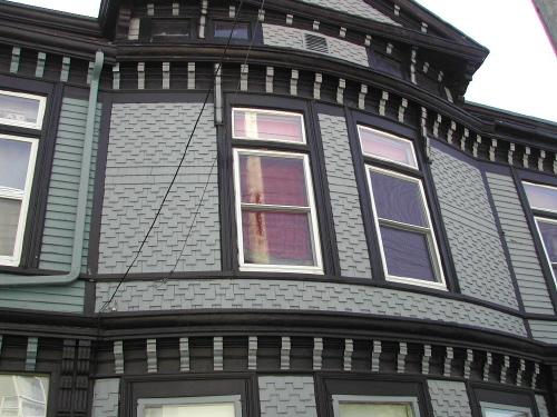 This photograph illustrates the bracketed roof-lines and the slight bow window in the front façade, 2007; City of Saint John