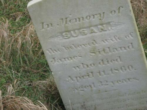 View of the headstone of Susan Sitland, daughter of the first known settlers to Burnt Islands, Church of England Cemetery, Burnt Islands, NL. Photo taken 2009. ; Bernadette Taylor 2009