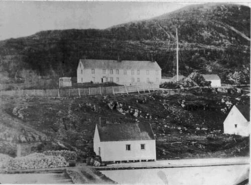 Newman and Company plantation, Harbour Breton, NL circa 1892 showing the flag on Newman’s Flagpole Rock. ; Elliott Premises (Newman and Co. Photo Album) 2009