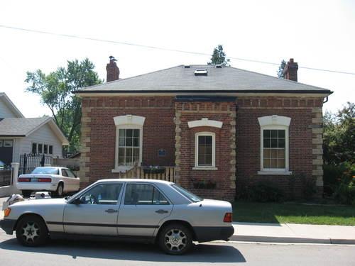 Of note is the low hip roof.; Beatrice Tam, 2008.