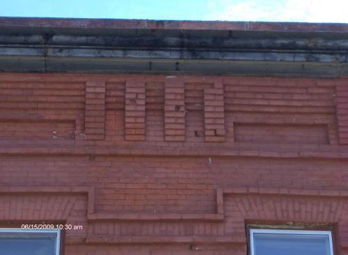 This photograph illustrates the corbel bands of the cornice, 2009; Town of St. Andrews