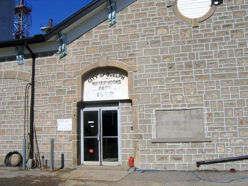 Of note are the paired roof brackets and carved stone surrounds on entrance door and vent.; Mary Tivy, 2008.