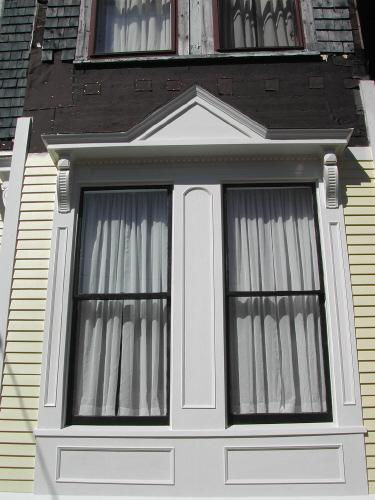 This photograph shows a renovated window in keeping with the style, 2007; City of Saint John