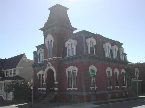 This photograph illustrates the contextual view of this landmark corner residence, 2007; City of Saint John
