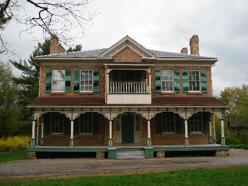Of note are the symmetrical proportions of the main block and decorative Queen Anne style veranda.; Paul Dubniak, 2008.