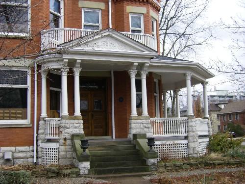 Of note are the front entrance and porch with upper balcony.; Kayla Jonas, 2008.