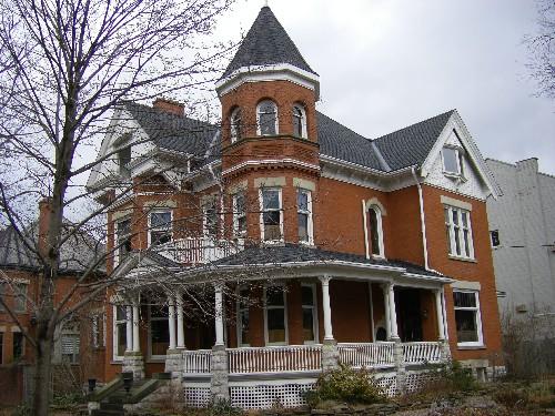 Of note are the wrap-around veranda, three-storey tower with conical roof and oriel window.; Kayla Jonas, 2008.