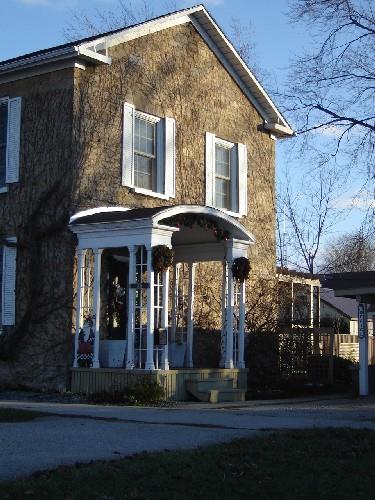 Of note are the gable roof and portico over the entrance.; Kayla Jonas, 2007.