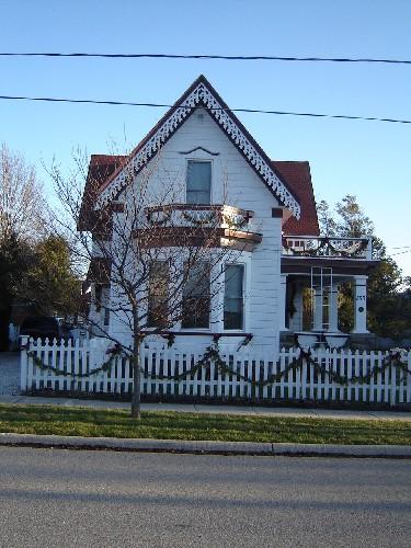 Of note is the sharply-pitched gable roof, with  intricate bargeboard.; Kayla Jonas, 2008.