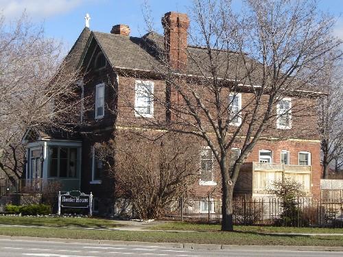 Of note is one of the tall ornate brick chimneys.; Kayla Jonas, 2008.