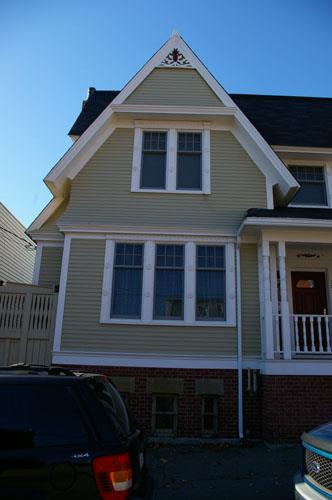 This image shows the shallow cross-gable with flared eaves; City of Saint John