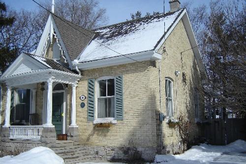 Of note is the decorative fretwork and finial on the centre gable.; Kayla Jonas, 2008.