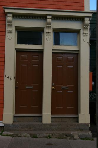 146-148 Carmarthen dual entrance with transom windows and shared entablature; City of Saint John