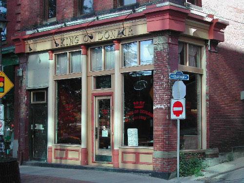 Image showing the storefront and illustrating the cast iron pilasters, end columns, cornice, windows, and entrance; City of Saint John 2004