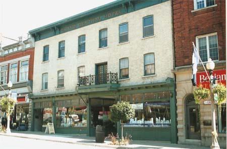 Of note are the symmetrical fenestration, first-storey storefronts and second-storey veranda.; Gord Strathdee, 2007.