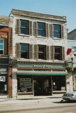 Of note is the typical limestone storefront facade and flat roof.; Gord Strathdee, 2007.