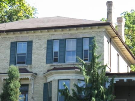 Featured are the projecting eaves, supported by brackets, and two of the four matching chimneys.; Paul Dubniak, 2008.