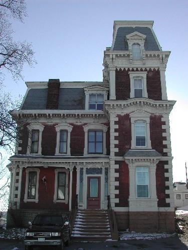 This photograph shows the contextual view of the building; City of Saint John